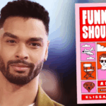 Regé-Jean Page junto ao livro que irá adaptar